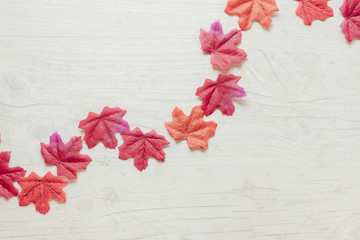 Top view autumn leaves on wooden background