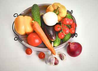 Fresh autumn vegetables on a white background