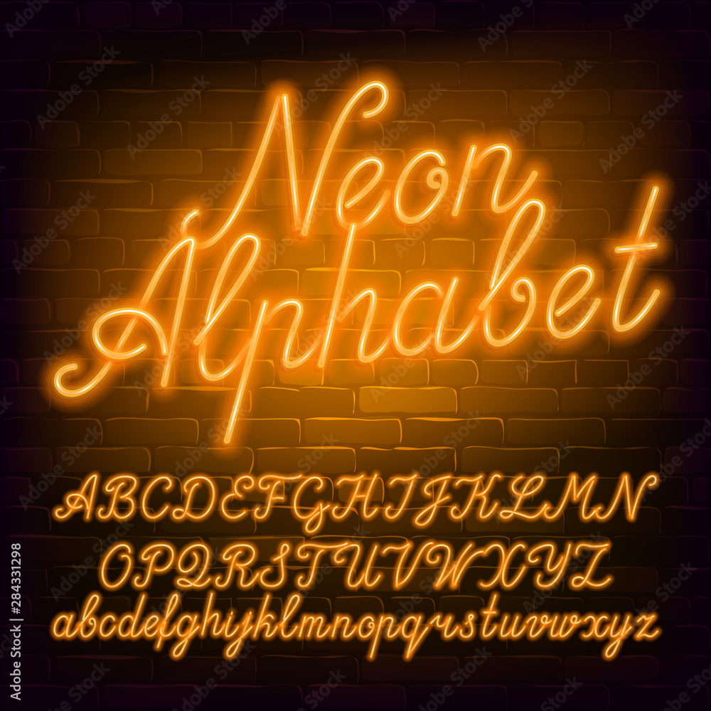 Fototapete neon script alphabet font. yellow neon color lowercase and uppercase letters and numbers. brick wall