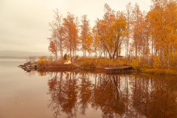 Autumn between villages  nature and water in Scandinavia
