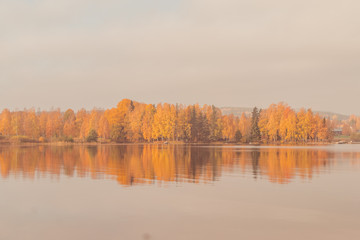 Autumn between villages  nature and water in Scandinavia