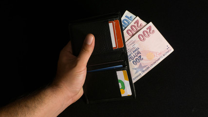 Photo of Turkish money and wallet. Turkish Currencies and credit cards