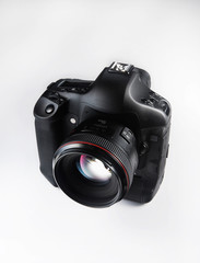 Digital camera on white background.