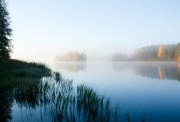 Beautiful autumn morning landscape of Kymijoki river waters in fog. Finland, Kymenlaakso, Kouvola.