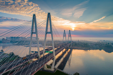 Fototapeta na wymiar Russia. Saints Petersburg Cable-stayed bridge. The Cable-stayed bridge over the Neva River. Bridges of St. Petersburg. Neva River at sunset. Bridgework across the river in Russia. City architecture.