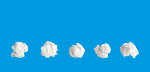 Paper ball array on blue background