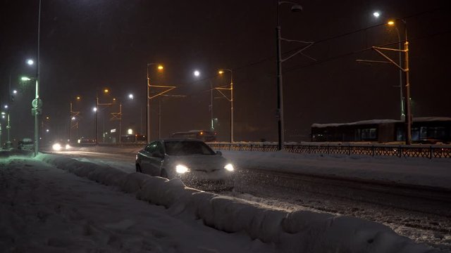 Snowing inside headlights of a car on The Golden Horn at night as cinemagraph
