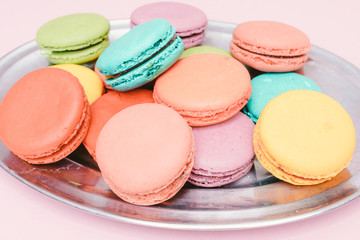 Fototapeta na wymiar colorful almond cookies on pink background