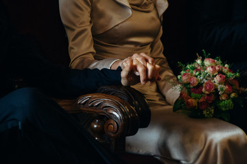 Couple holding hands while they're getting married - Powered by Adobe