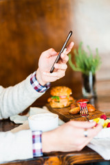 Man using phone during meal