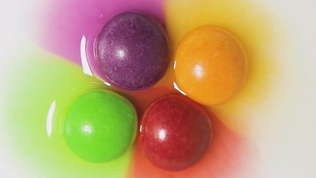 colored caramel is dissolved in water (time-lapse)