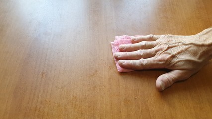 Table cleaning. Wipe the table with a rag. Wash the table.