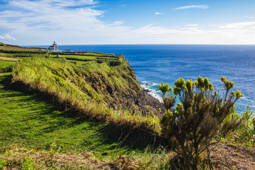 view of Farol da Ponta da Ferraria lighthouse from Miradouro da Ilha Sabrina, Sao Miguel Island, Azores, Portugal