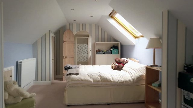 Dolly Zoom of an Attic Room and En Suite in a Family Home in Slow Motion
