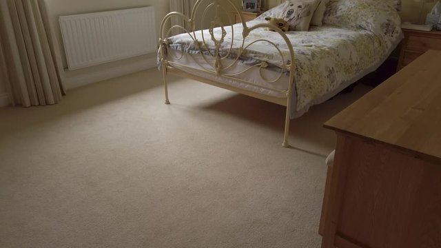Upward Tilt Shot of a Modern Looking Bedroom in a Rural Home