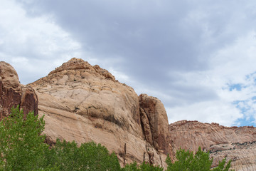 Fototapeta premium Capitol Reef National Park low angle landscape of massive white stone mountains
