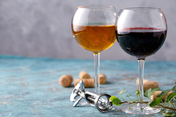 Glasses of white and red wine. The concept of winemaking. Place under your text. Still life on a textural background.