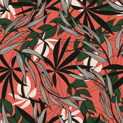 Original abstract seamless pattern with colorful tropical leaves and plants on red background. Vector design. Jungle print. Floral background. Printing and textiles. Exotic tropics. Summer.