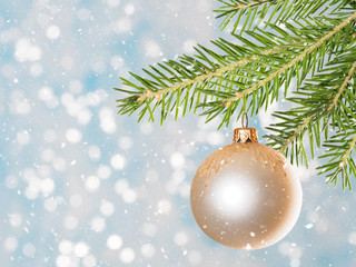 Fir tree branch with beige toy and snowflakes. Christmas holiday concept