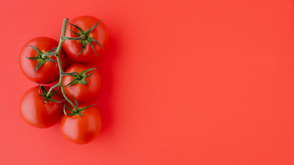 Red Tomatoes Close Up. Fresh Organic Tomatoes on Red Background, Directly from Above with Copy Space. Group of Objects, Healthy Eating, Healthy Lifestyle, Product