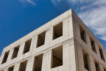 A modern concrete office building under construction