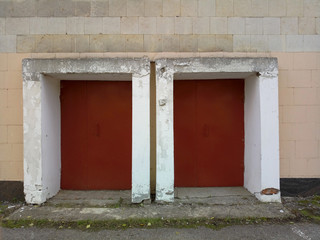 old red doors on the facade of the building