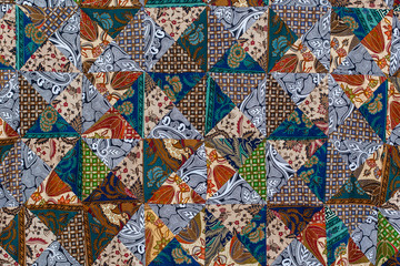 Detail patchwork quilt in street market. Bali island, Ubud, Indonesia. Closeup patchwork blanket texture