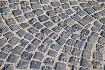 Cobbled stone pavement in grey colours