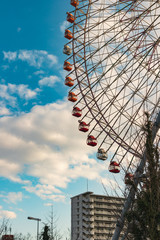Colorful ferris wheel against clear blue sky in Osaka, Japan