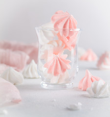 White and pink Bizet in a glass on a white background