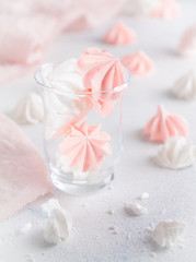 White and pink Bizet in a glass on a white background