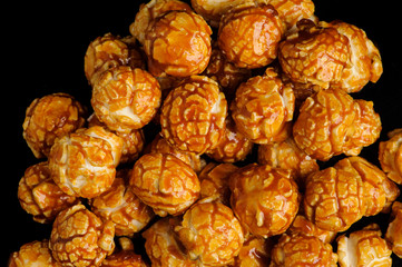 sweet Caramel Cream popcorn on the black background