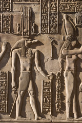 Egypt, Pom Ombo. Sidelight makes the hieroglyphics stand out in strong relief on the walls of Pom...