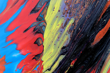 Abstract colorful painted background with lots of free space. Colorful wall texture. Abstract blurry colors of acrylic fill. Horizontal.