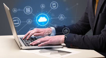 Fototapeta na wymiar Businessman hand typing with cloud technology system and office symbol concept