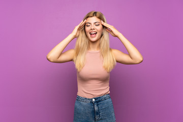Teenager girl over isolated purple background with surprise expression