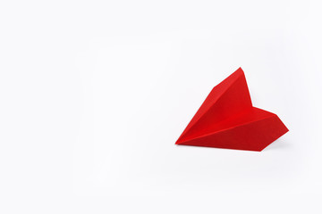 Red paper airplane isolated on white background. top view.