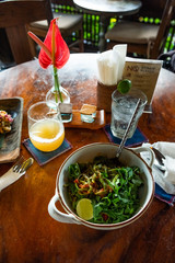 Board with tasty vegetarian pasta on wooden table