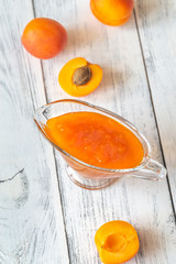 Glass vase of apricot jam