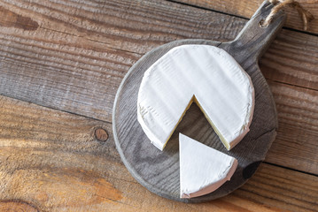 Camembert cheese on the wooden board