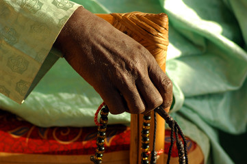 MALI, Bamako. Black hand holding a muslim prayer chaplet 