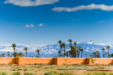 Outside The City Ramparts, High Atlas mountains behind, Marrakech, Morocco.