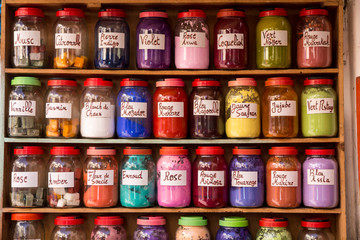 Morocco, Essaouira. Jars of powdered dye arranged in a colorful array along the street market.