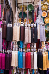 Morocco, Marrakech. Curtain tie-backs for sale at a market stall in the medina.