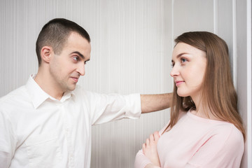 Fototapeta premium A young man flirts with an attractive girl