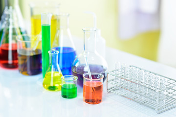 Laboratory glassware with colorful chemical reagent in research laboratory 