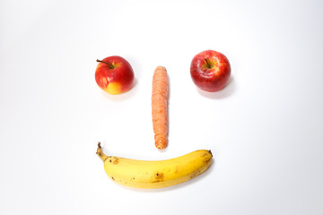Happy smiling fruit face on white background