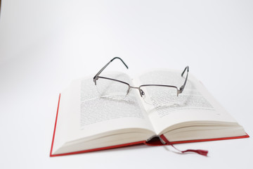 Glasses lying on a book closeup