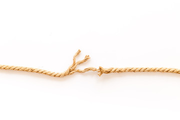 Tearing the rope under stress on white background top view copyspace