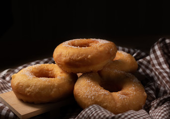 Group of sugar donuts on table